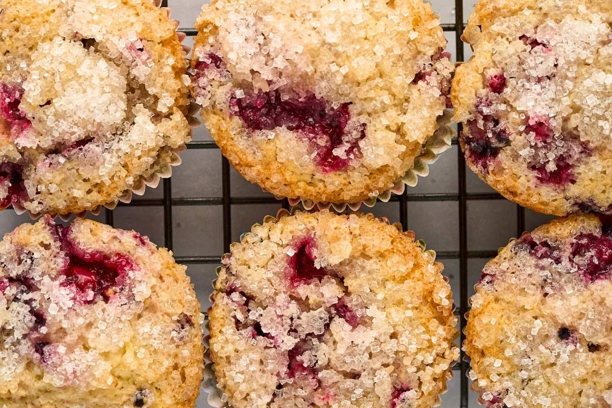 overhead view of finished muffins on cooling rack.