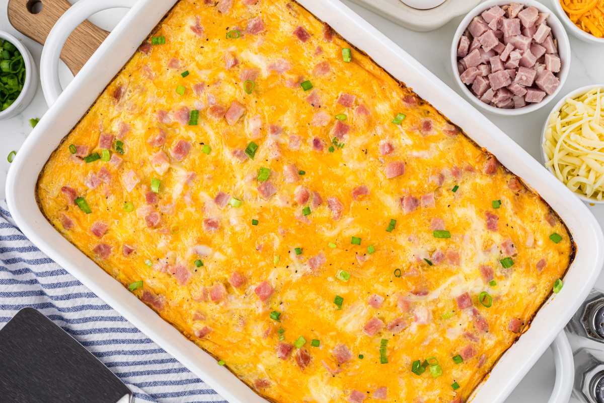 The fully baked casserole, golden-brown on top, garnished with chopped green onions, ready to serve.