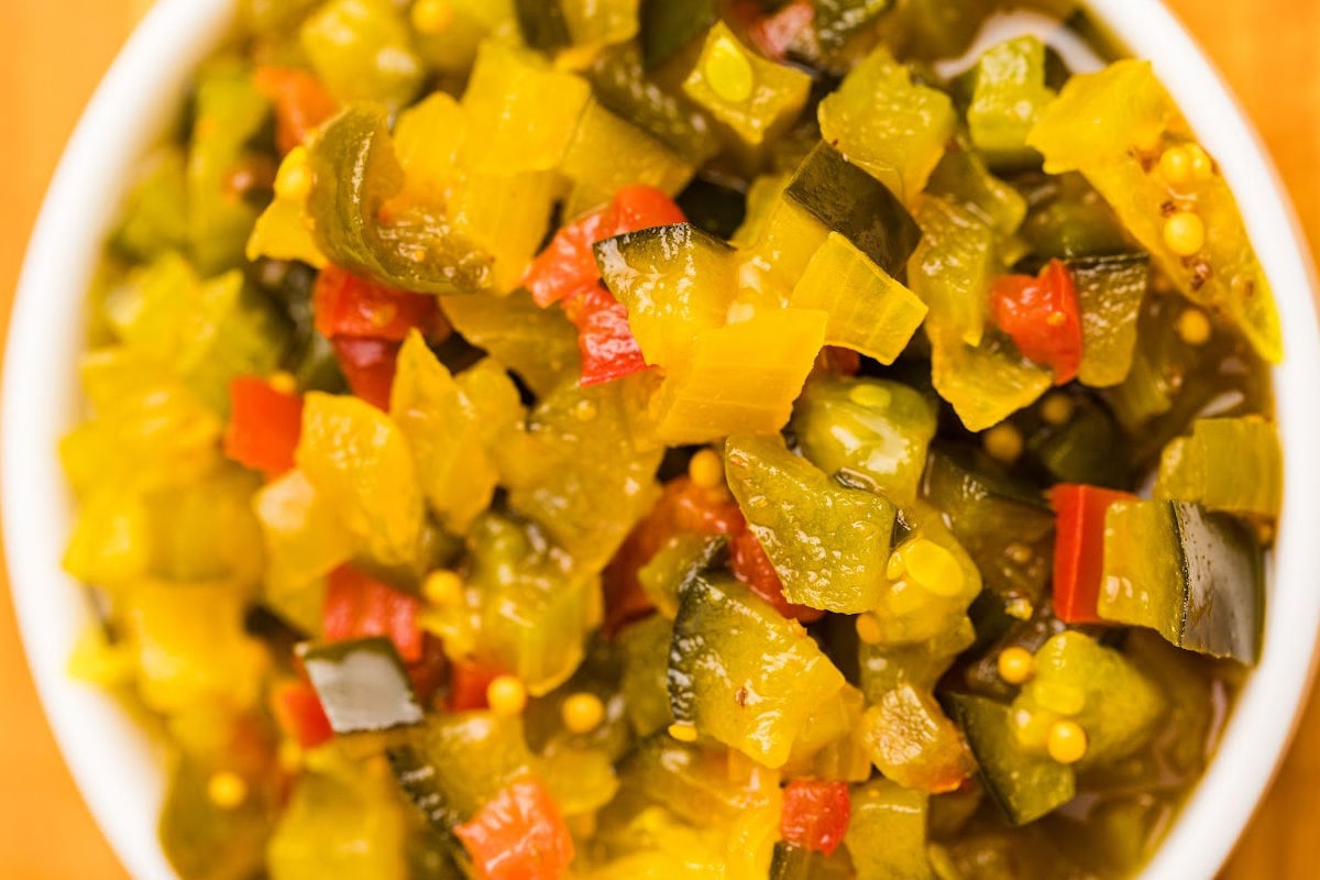 close up of pickle relish in white bowl.