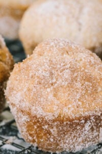 close up view of cinnamon sugar muffins on cooling rack