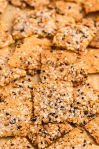 Close-up of baked sourdough discard crackers topped with everything seasoning.