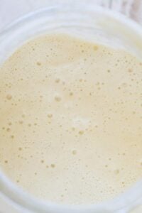 bubbly sourdough starter in jar