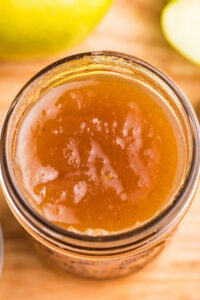 overheard view of homemade apple jam with spices.