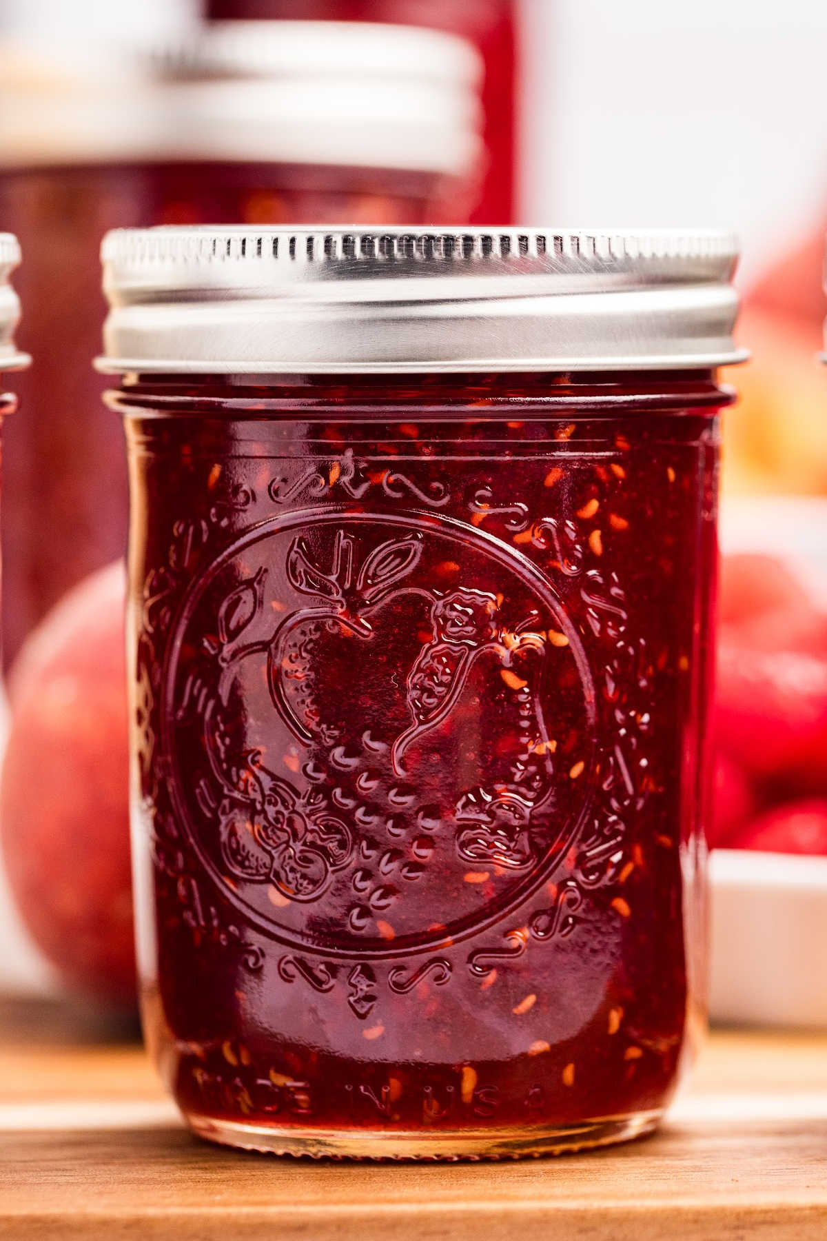 mason jar filled with peach raspberry jam
