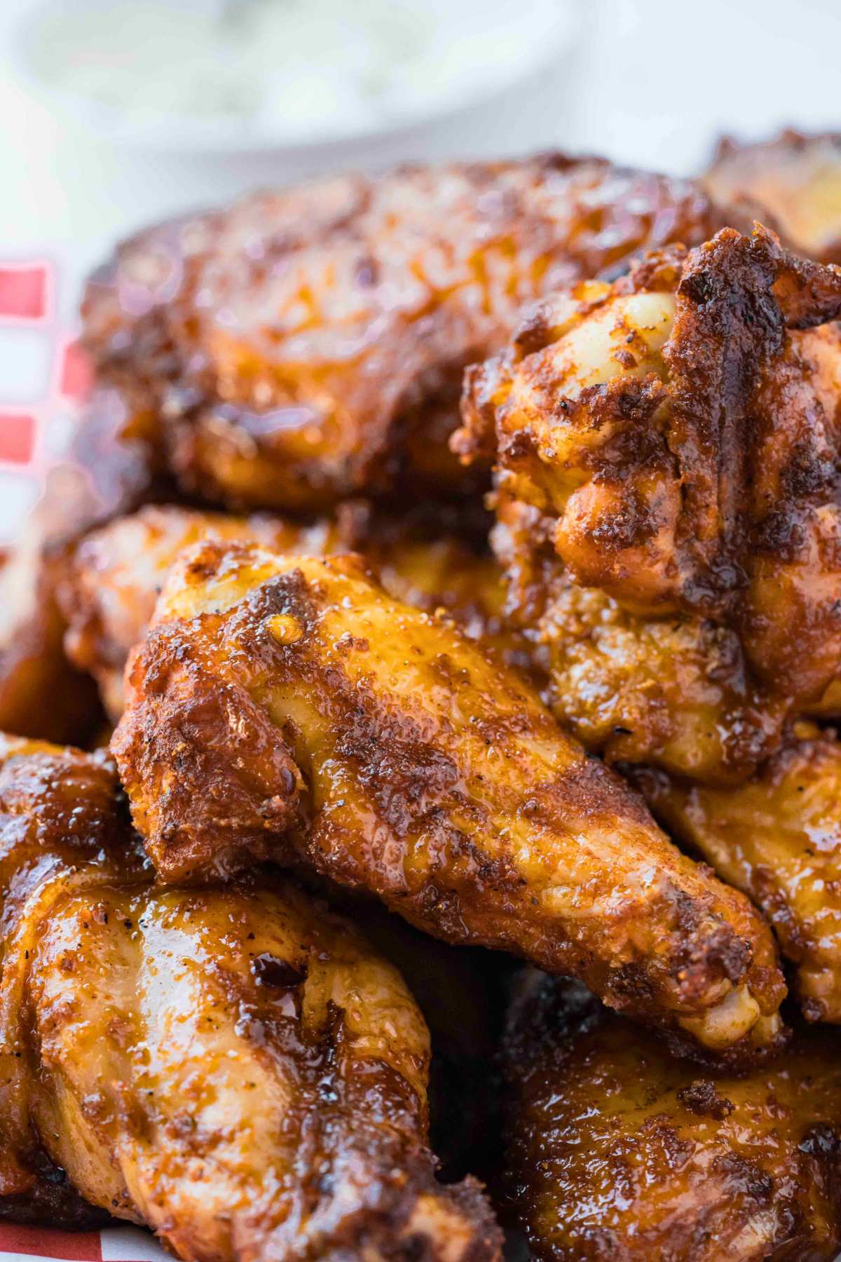 a pile of smoked chicken wings with a caramelized glaze.