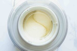 overhead shot of custard in ice cream maker.