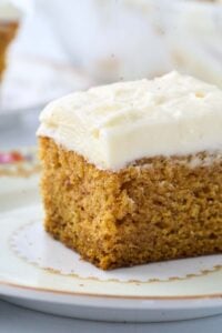 square piece of cake with cream cheese frosting