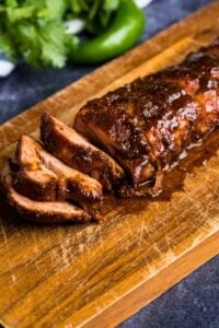 overhead shot of pork tenderloin cut in slices.