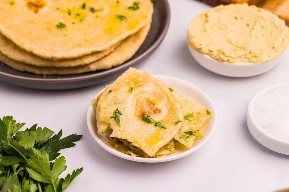front shot of naan pieces in bowl on counter.