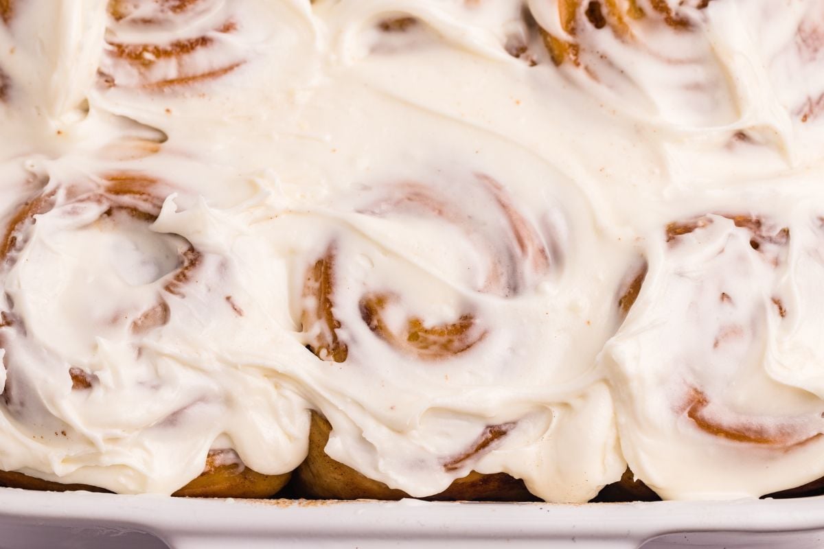 Overhead view of cinnamon rolls with cream cheese frosting