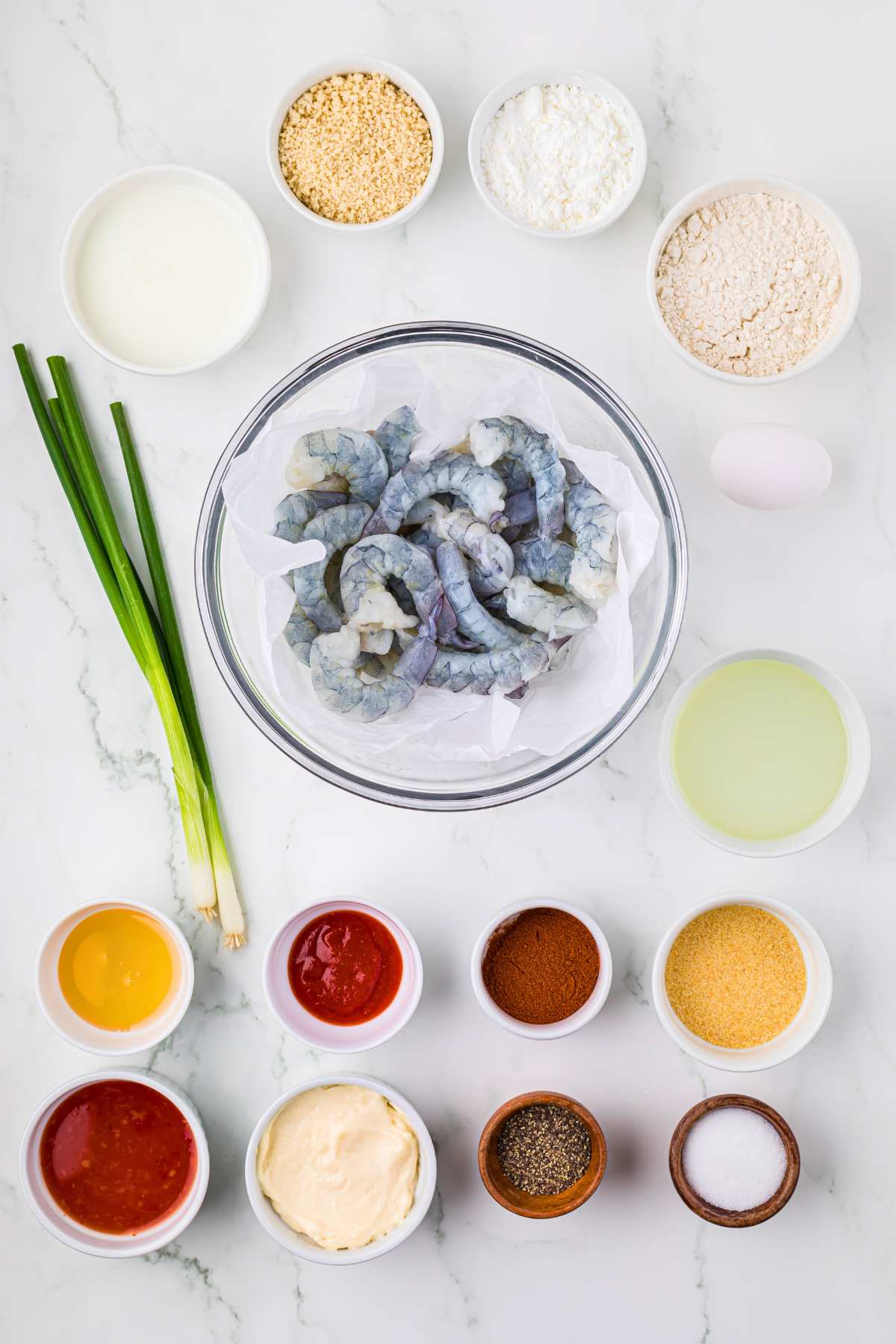 overhead shot of pre-measured ingredients in bowls on counter.