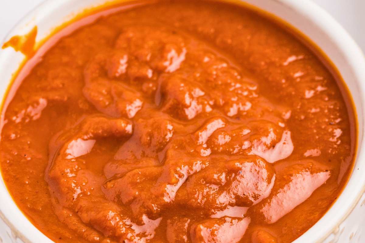 close up of enchilada sauce in bowl.