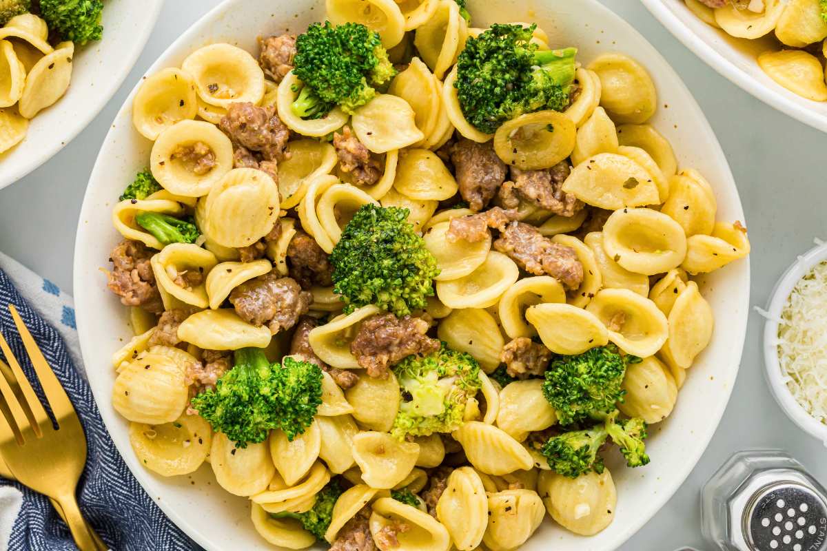 overhead shot of sausage broccoli pasta on plate.