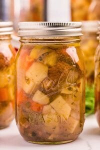 front shot of beef stew inside jar.