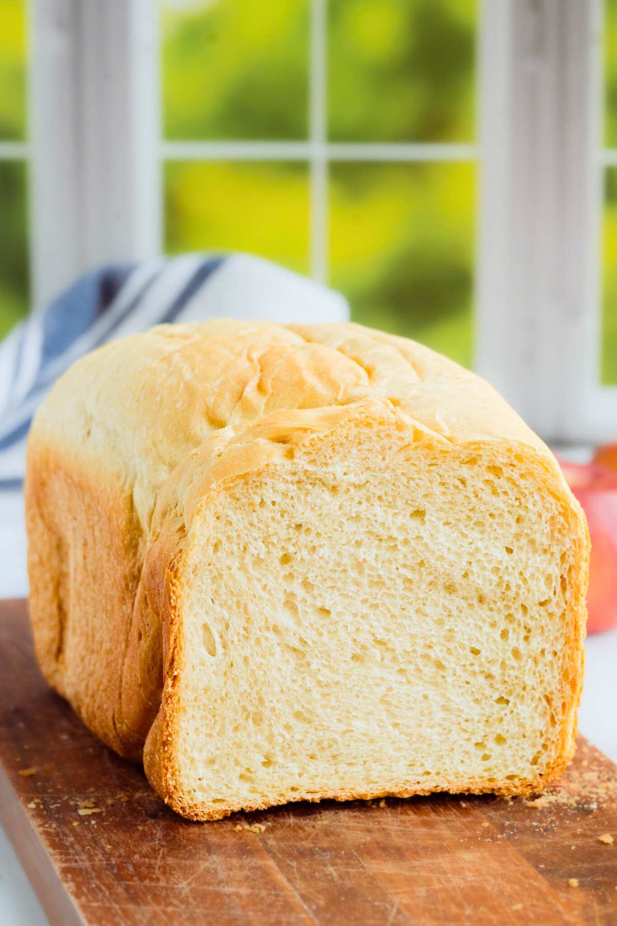 front shot of loaf with end cut off to reveal inside of bread.