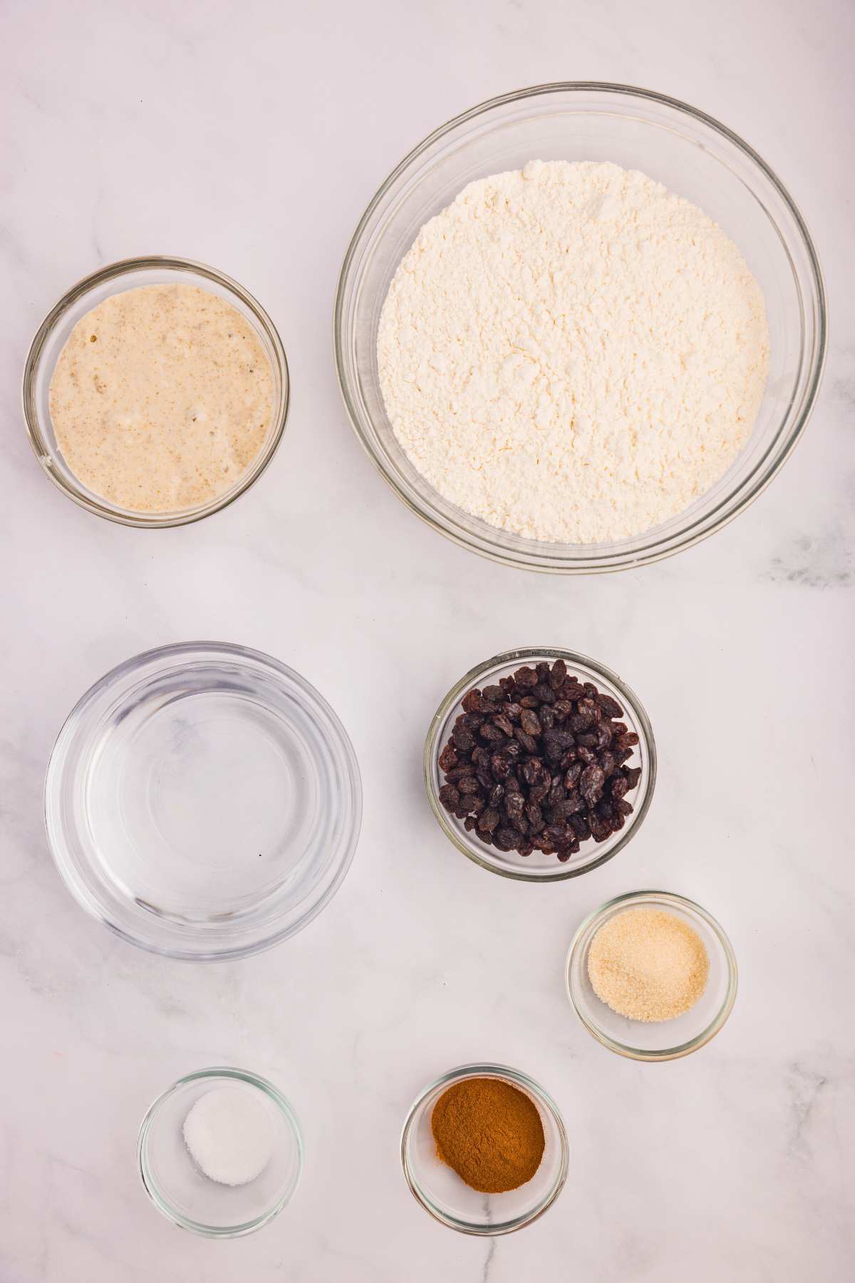sourdough bread ingredients measured out on counter.