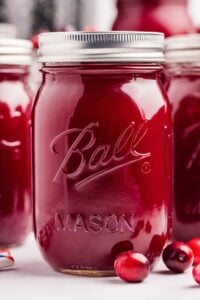 jars filled with cranberry juice.