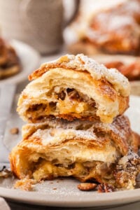 pecan pie croissants, cut in half on plate.