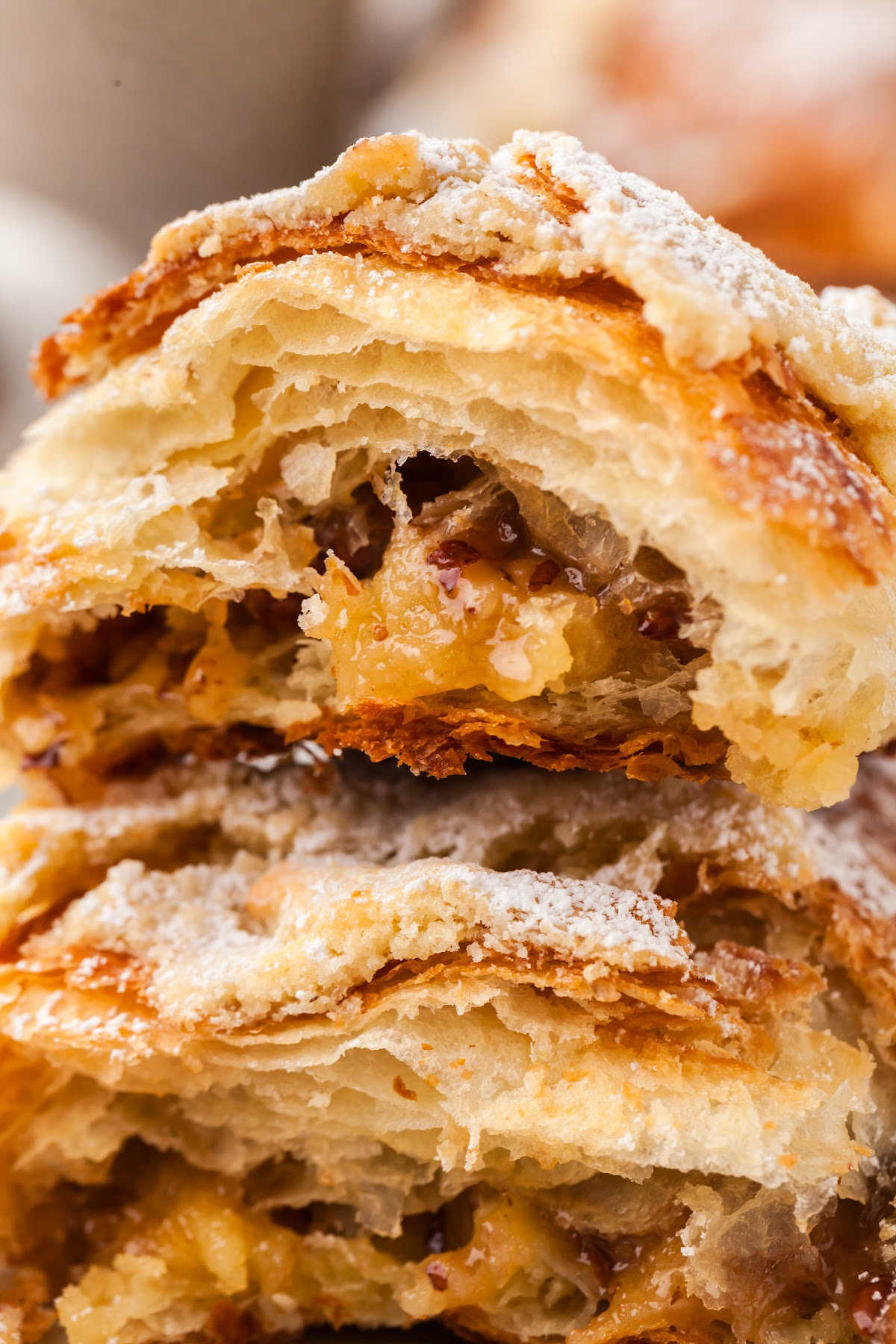 close up view of sliced croissants with pecan filling.