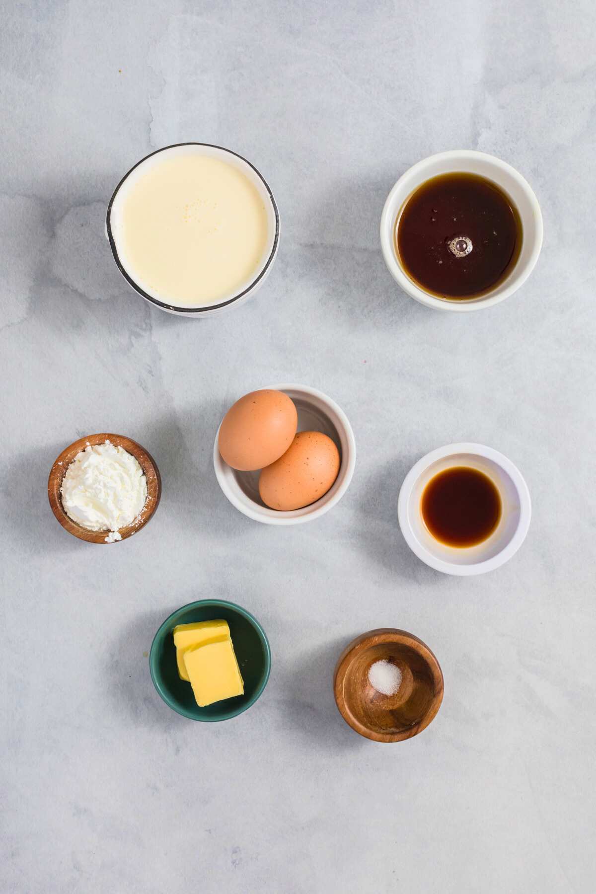 pudding ingredients measured out in bowls on counter.