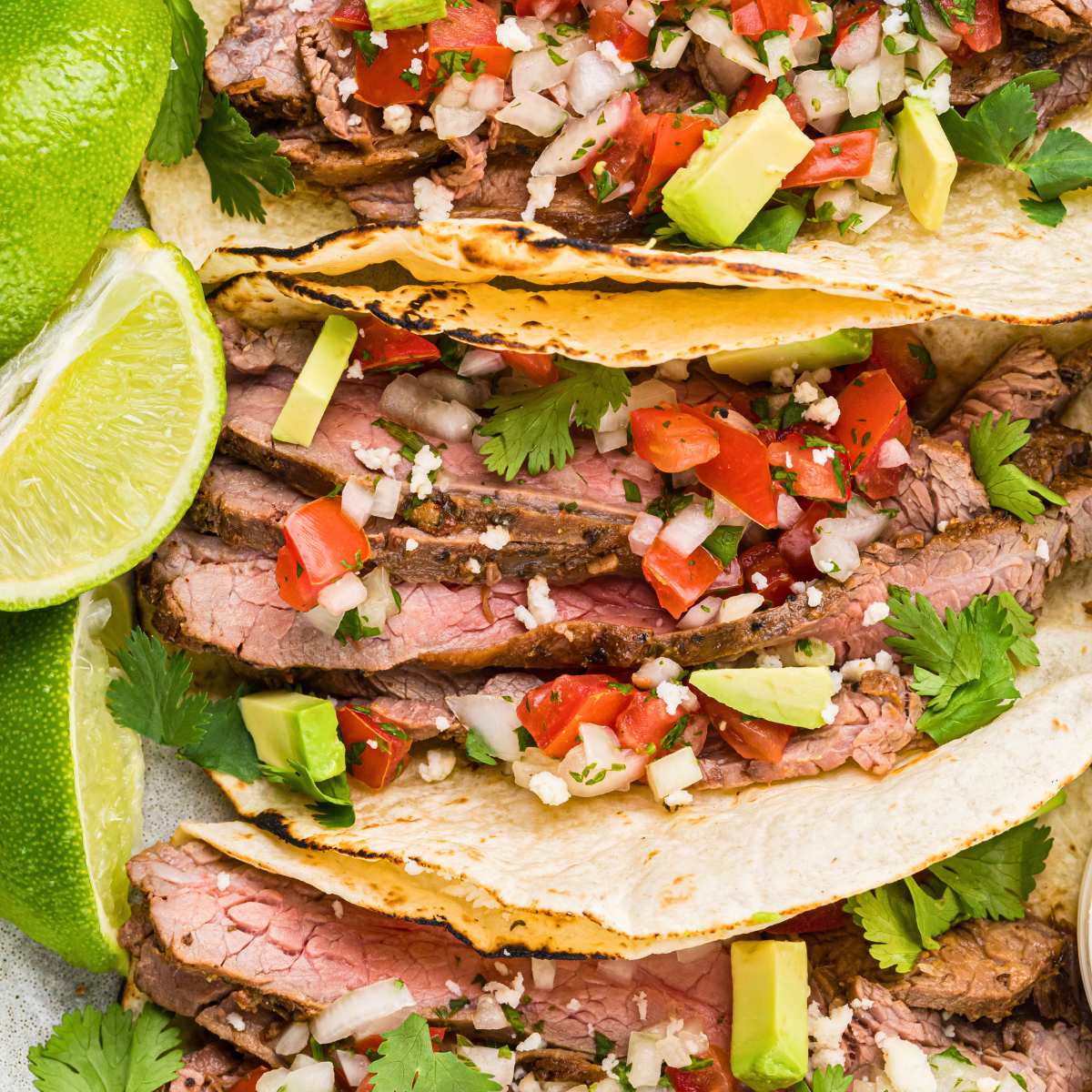 overhead of tacos lined up vertically.