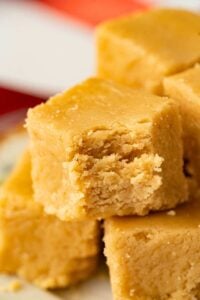 fudge square with bite taken out, stacked on other squares.
