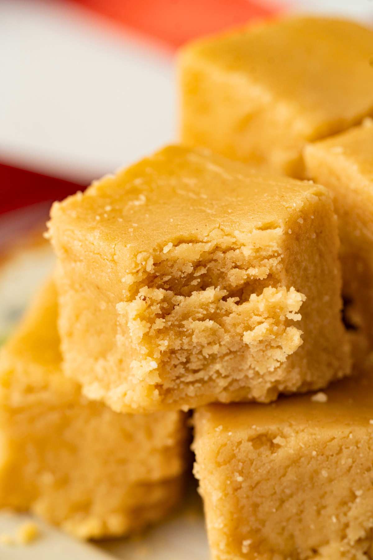fudge square with bite taken out, stacked on other squares.