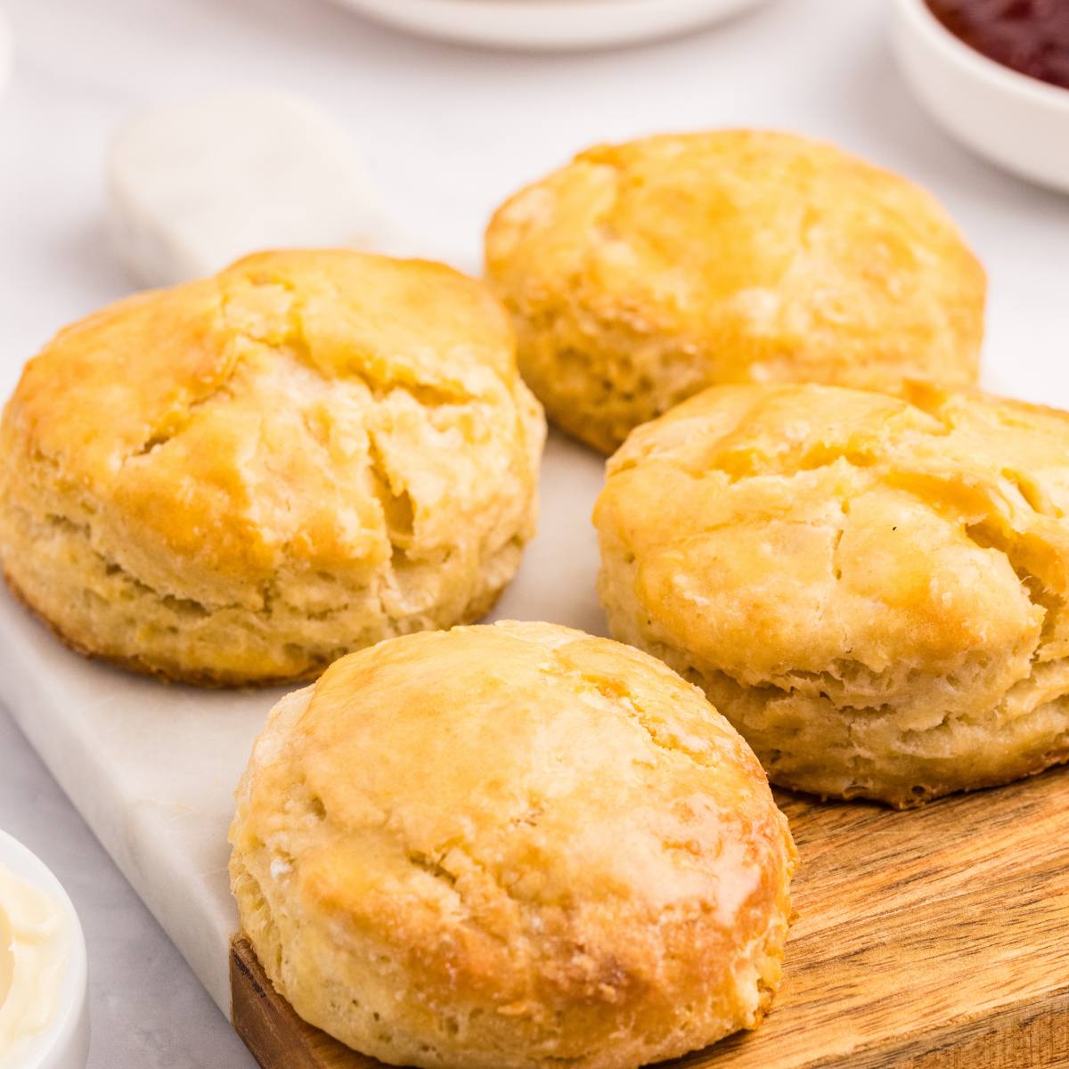 four sourdough biscuits on counter.