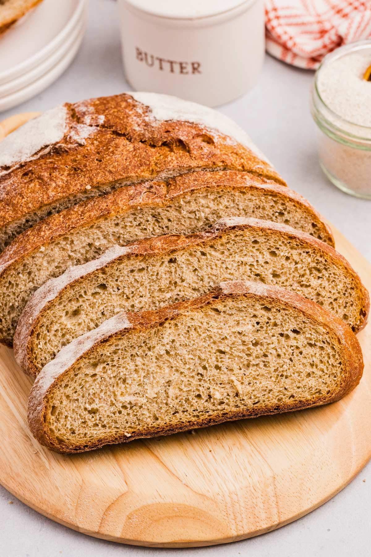 slices of sourdough rye bread on wooden board.