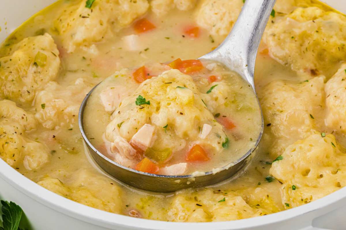 soup served in bowl with spoon.