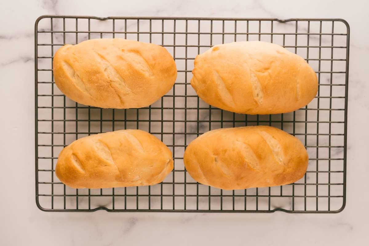 hoagie rolls cooling on wire rack.