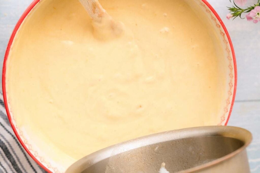 milk being poured into bowl