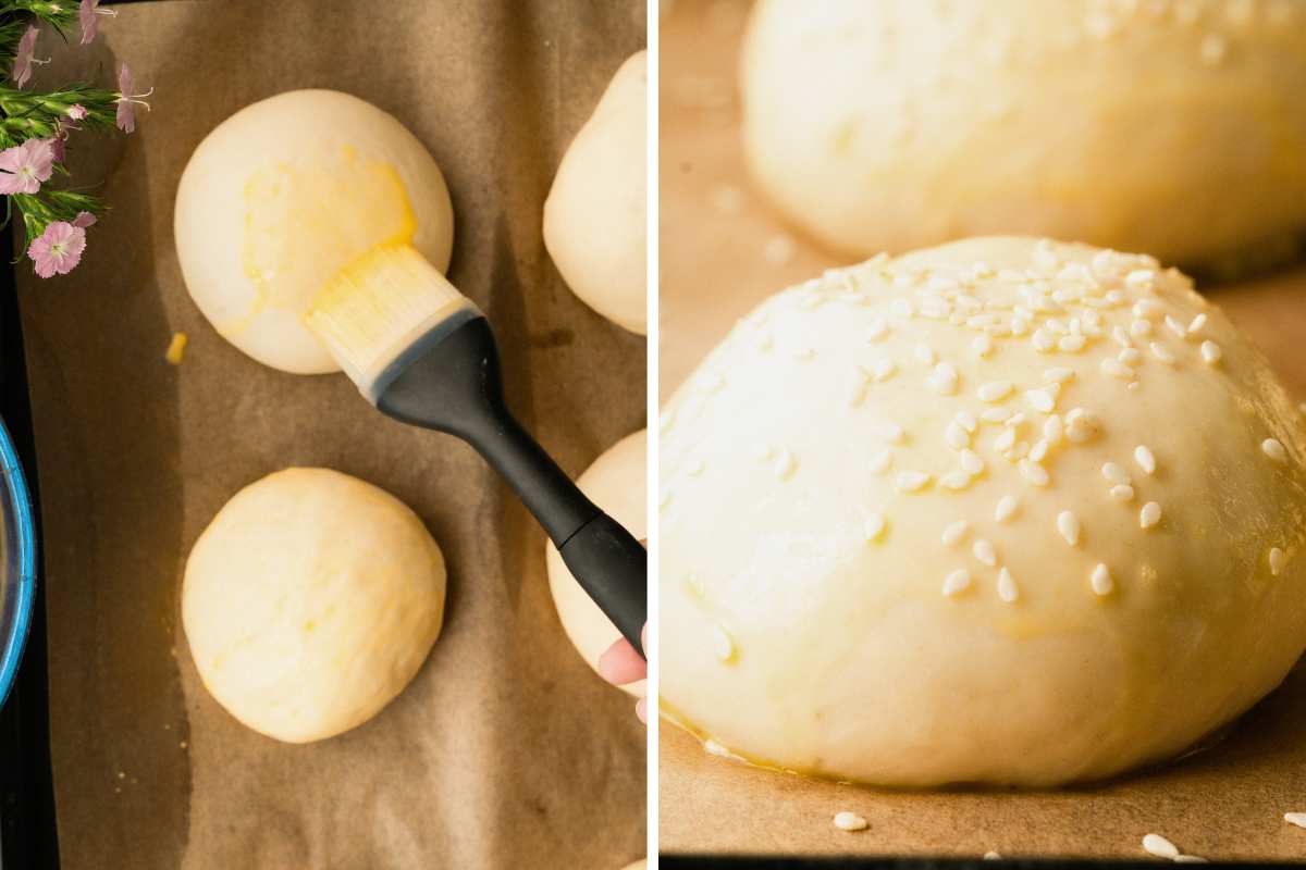 dough buns brushed with egg wash and topped with sesame seeds.