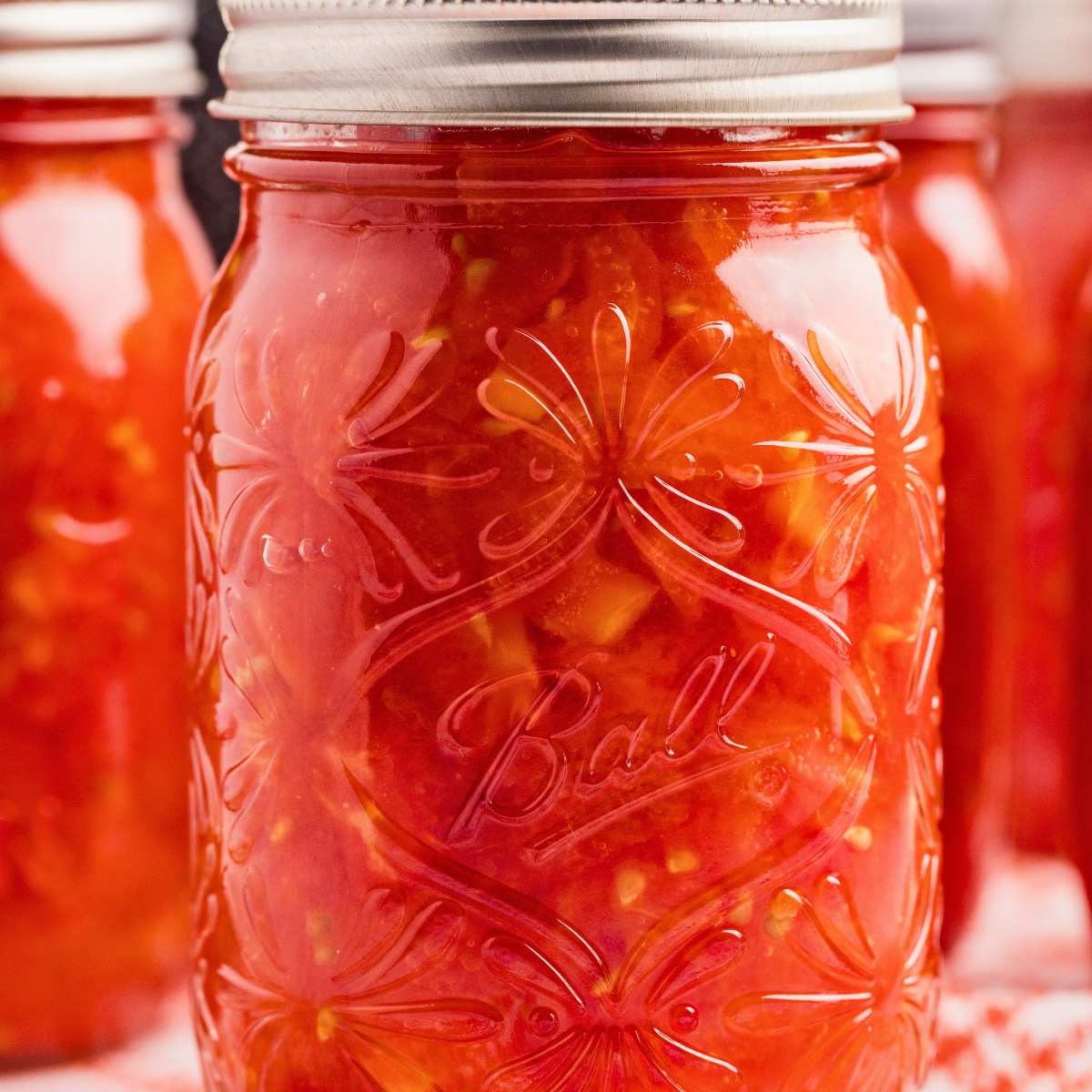close up of canned jar of diced tomatoes.