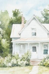 white country home with a peaked roof