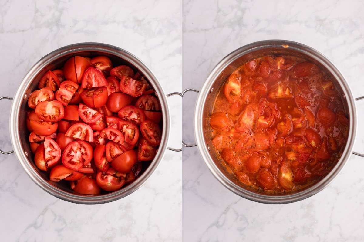 Tomatoes simmering in a large stainless steel pot.