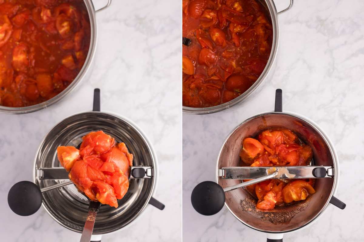 Cooked tomatoes being added to a food mill.
