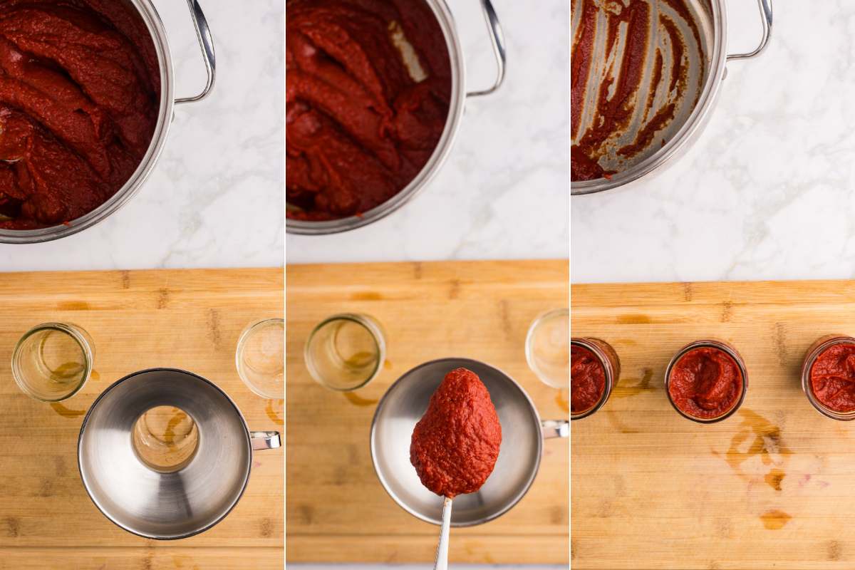 Tomato paste being ladled into jars with a funnel.