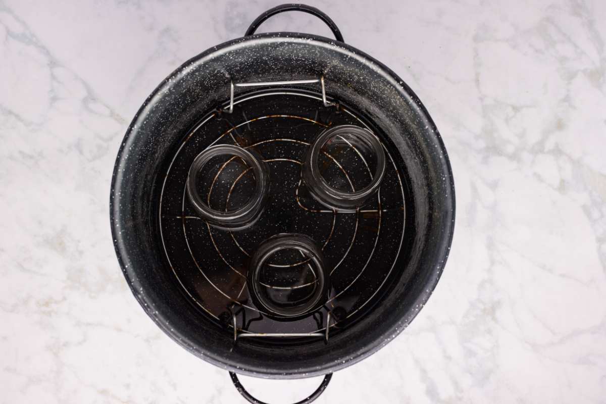 Empty jars placed in a water bath canner.
