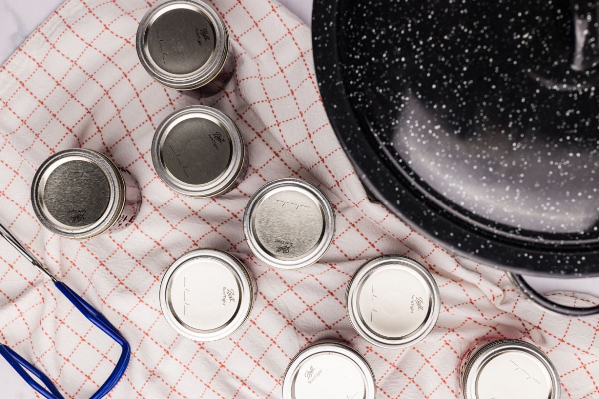 Sealed jars resting on a towel after processing.