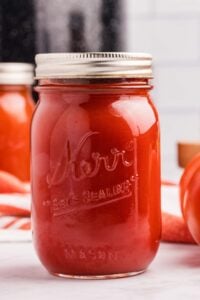 finished tomato sauce jars on counter.