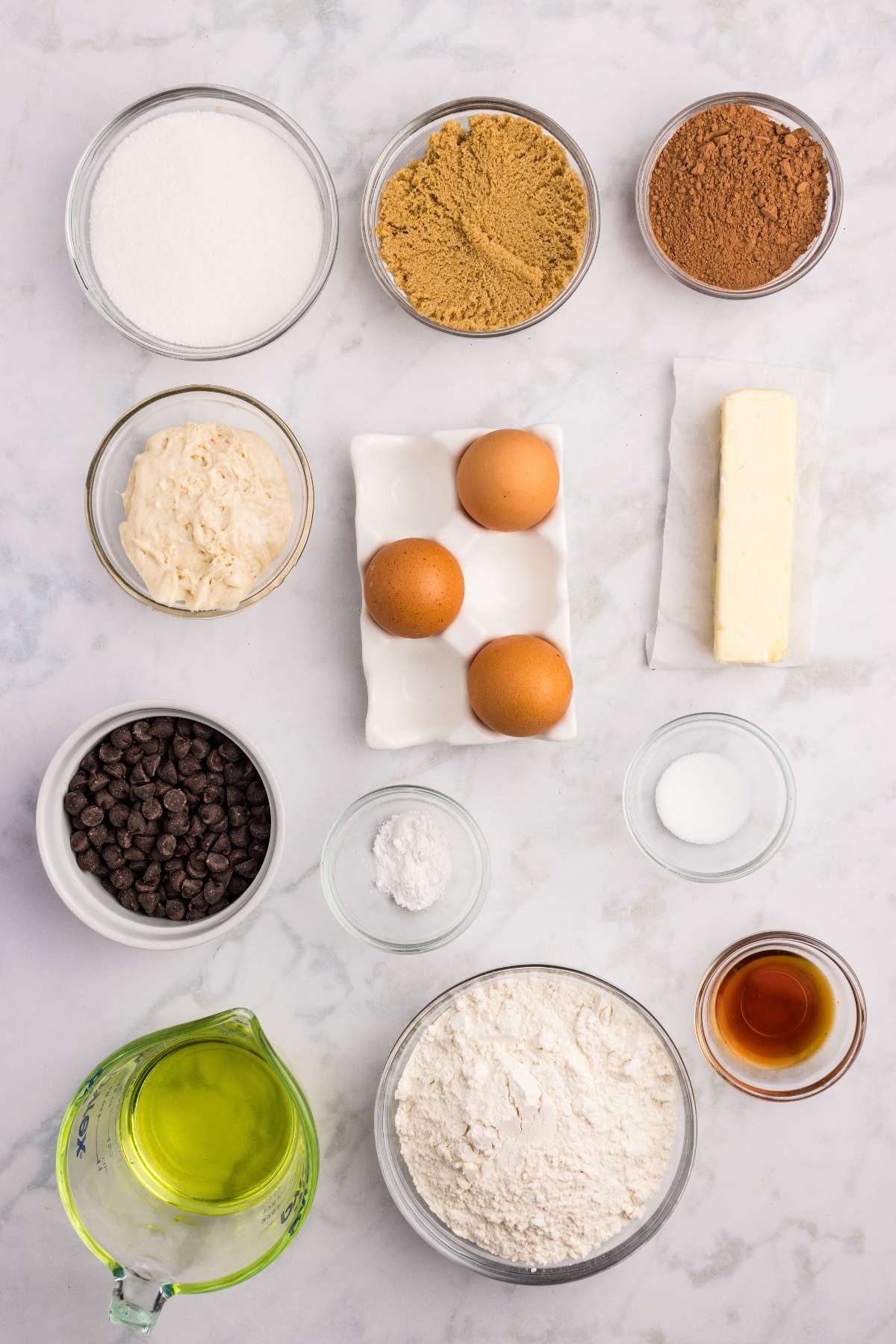 All ingredients measured in bowls on a white surface.
