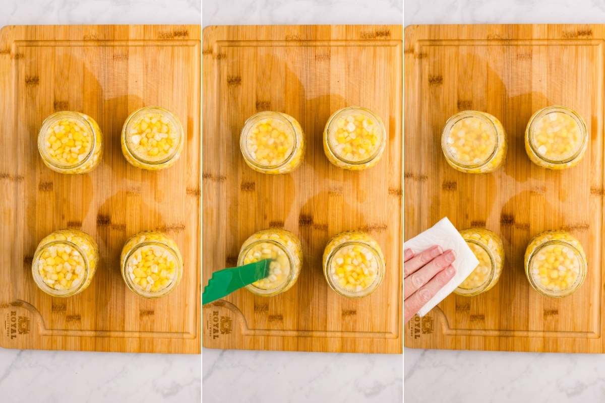Jars of corn being filled, debubbled, and wiped clean.