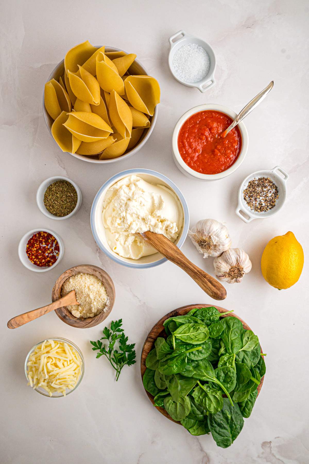 Ingredients for stuffed shells laid out on counter.