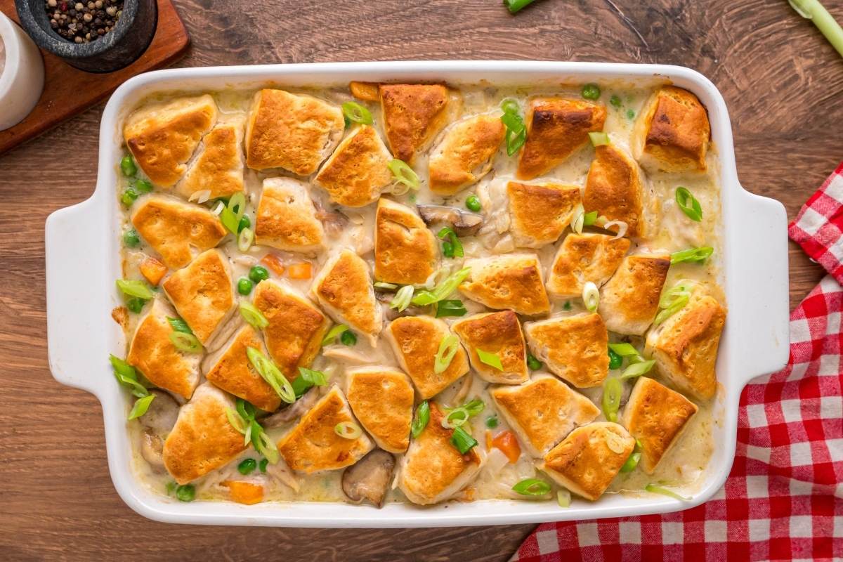 Baked casserole with golden biscuit pieces on top.
