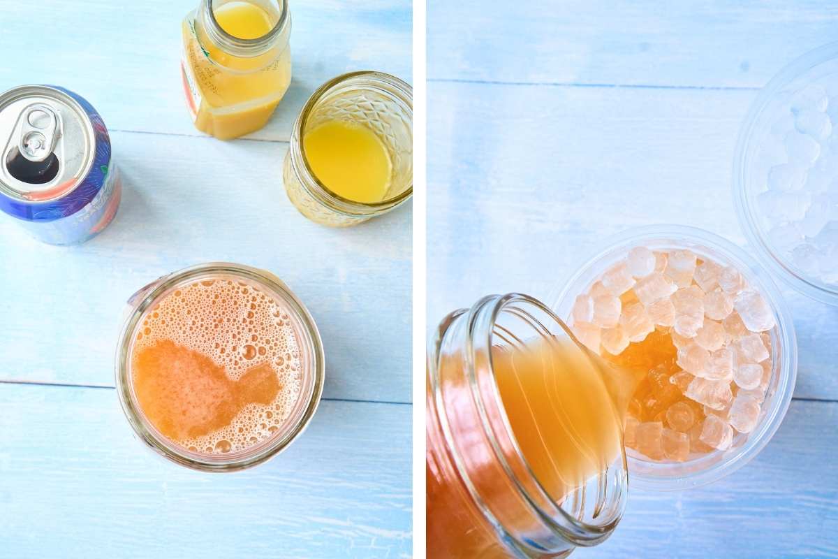 Mason jar with orange liquid and ice next to tropical juice cans and rum bottles.