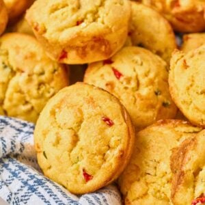 close up of jalapeño corn muffins in tea towel.