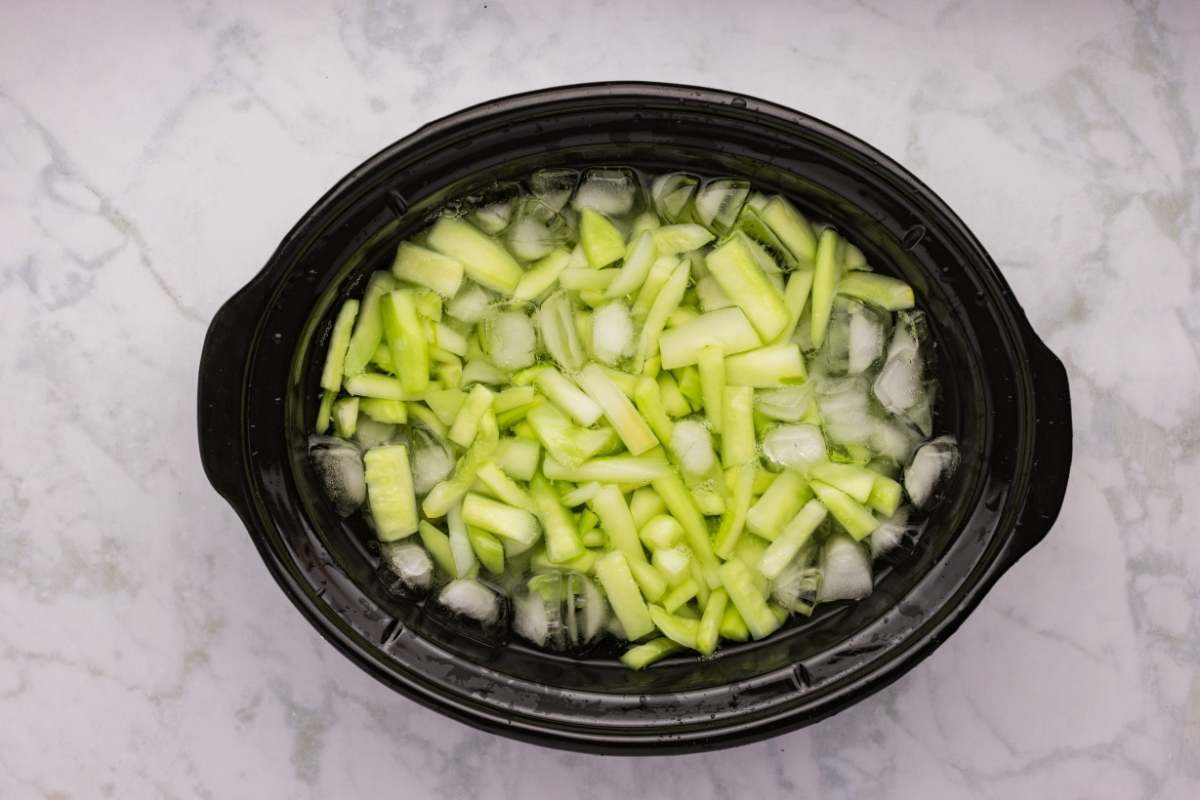 Cucumbers sitting in an ice water bath.