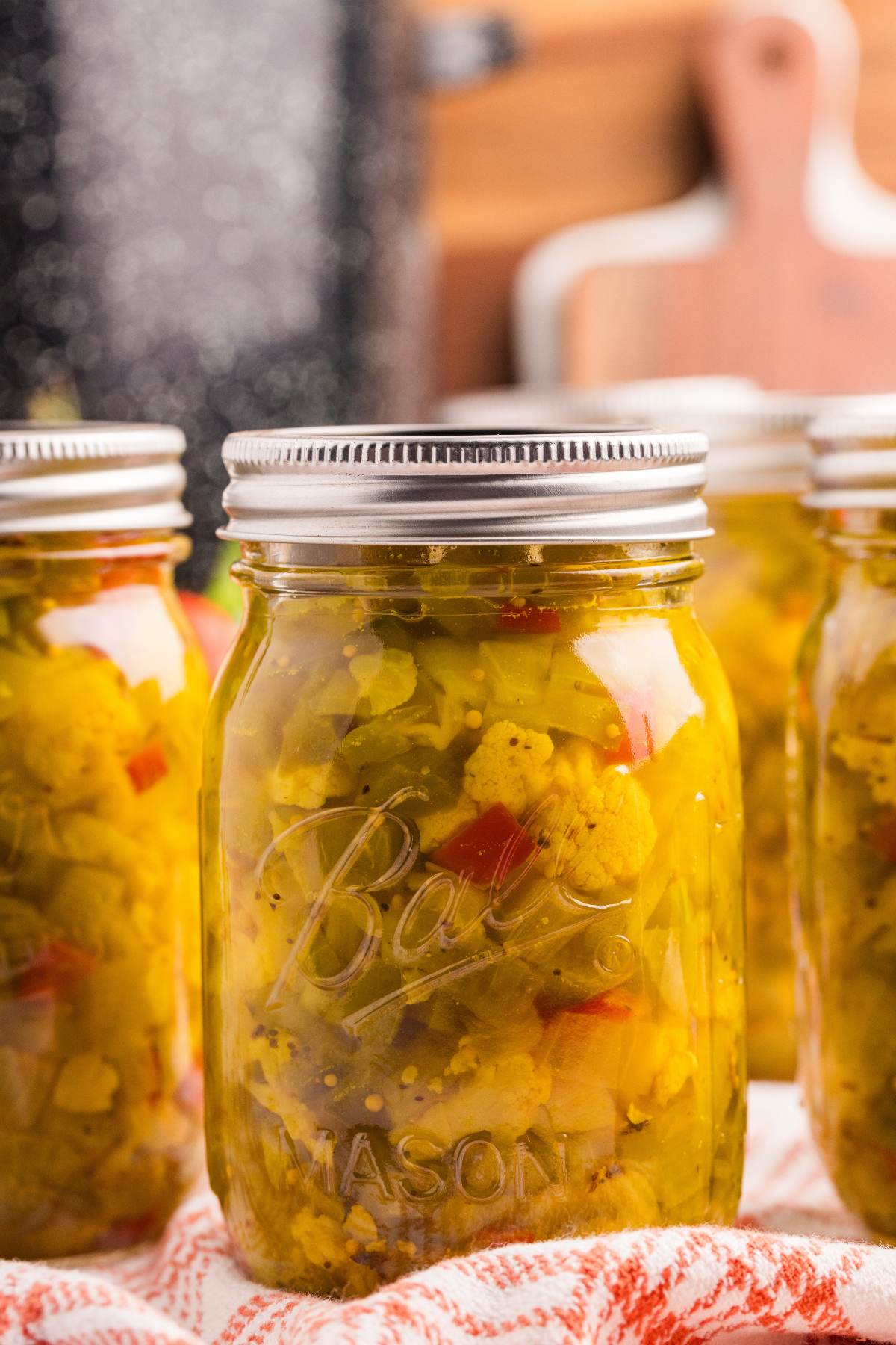 finished jars in front of canner.