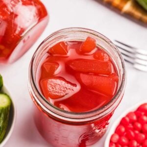 overhead view of open jar red pickles.